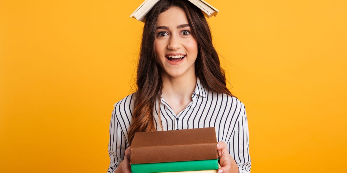 portrait-cheerful-young-girl-holding-books