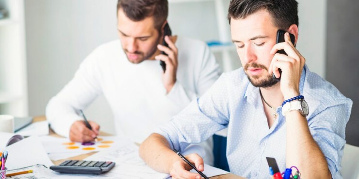 two-businessmen-talking-cellphone_23-2147839911-Copy