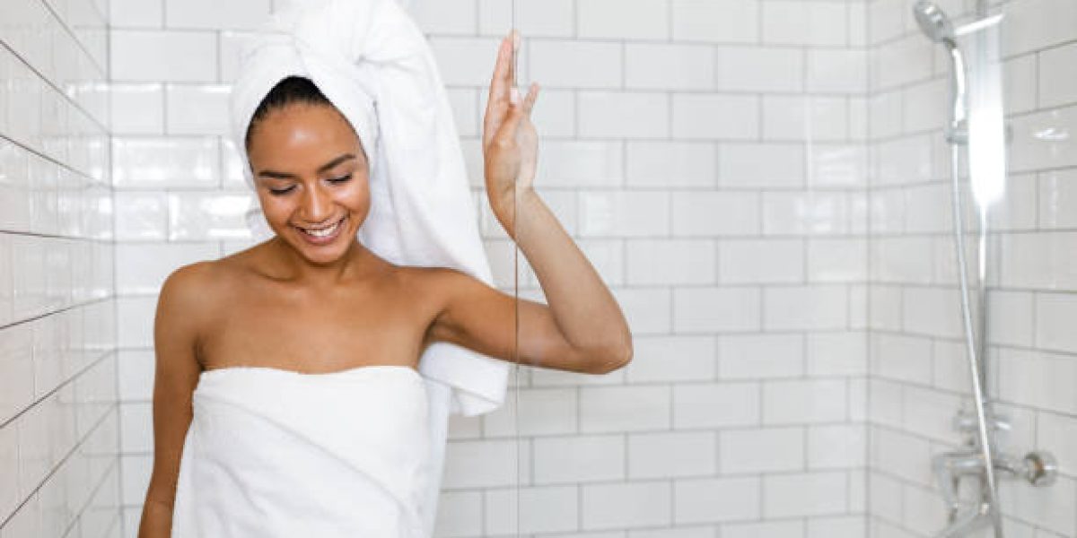 young-woman-in-white-towels-wrapped-around-head-and-body-after-shower